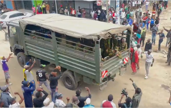 Ol Kalou residents celebrate as a lorry ferrying GSU officers is denied entry into one of the polling centres.